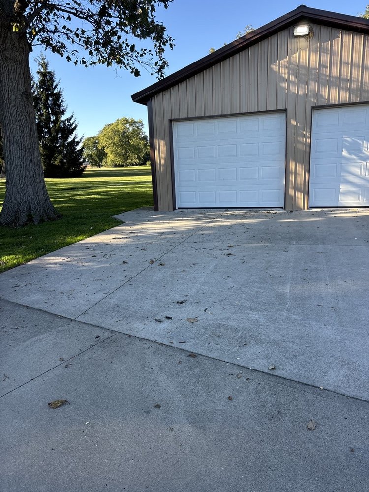 Residential garage and driveway area served by JJs Cleanup junk removal